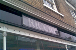 Acrylic panel with vinyl lettering and standoffs